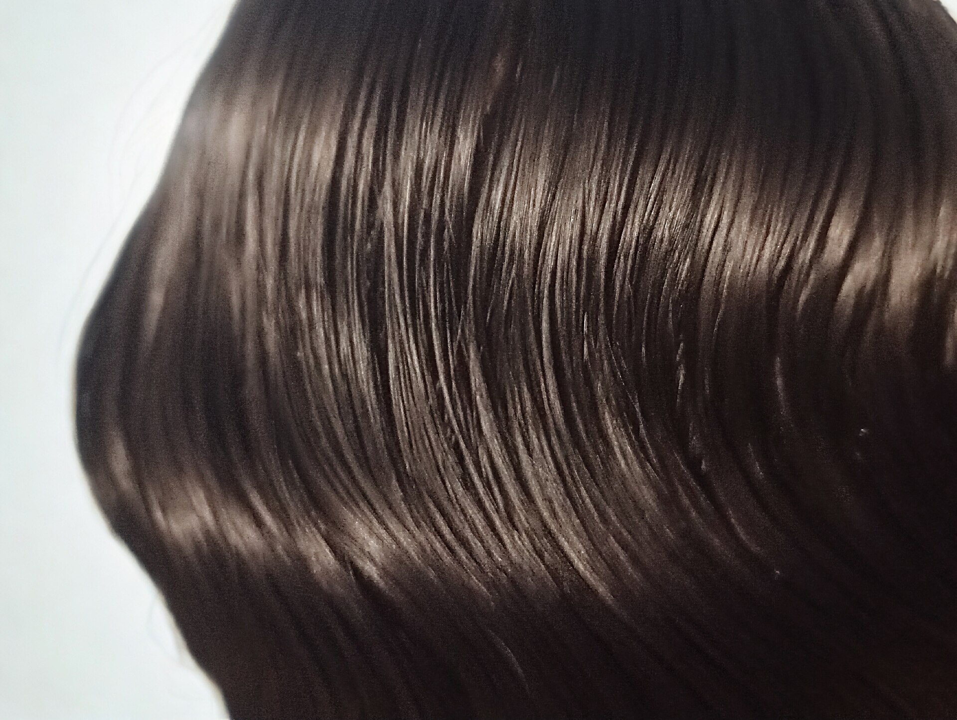 Straight dark hair close-up showing cuticle alignment